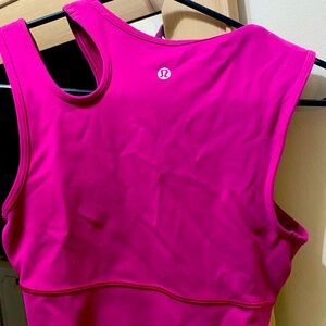 Unique LuLu athletic tank raspberry in color. Size 6 but fits like a 4.